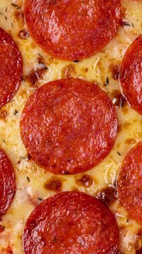 Closeup of pepperoni sausage style pizza