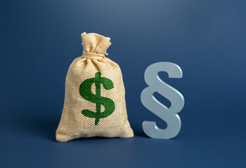 The dollar is a money bag and a symbol of the law paragraph. New laws and duties. State budget and expenditure items. Fiscal policy pressure, legal regulation, government spending priorities