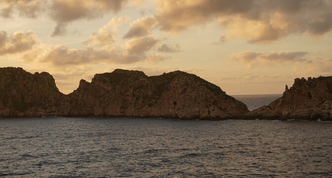 Evening scene over the Mediterranean Sea and its rocky coastline and rock formations Malgrat Islands, Santa Ponsa Region, Southwest Mallorca. 