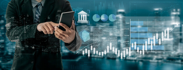 A businessman analyzes financial data on a smartphone amidst urban surroundings, showcasing stock market trends and digital graphics in a modern economic environment. Gantry