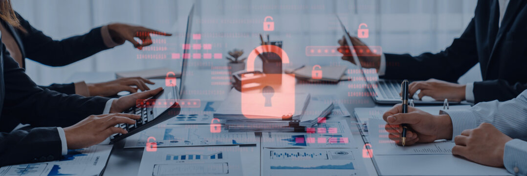 Team members engage in a business meeting while focusing on data privacy and cybersecurity, symbolized by a digital lock overlay in a modern workspace environment. Trope - Powered by Adobe