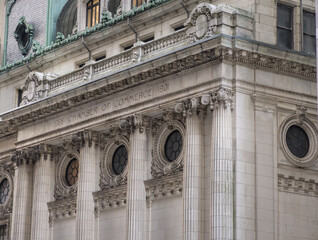 Chamber of Commerce building facade near Wall Street in Manhattan, New York City, United States of America.  Famous American financial institution.
