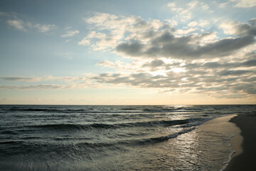 Fototapeta premium Picturesque view of beautiful sky with clouds over tropical beach at sunset