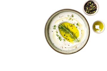 Bowl of sour cream sauce with herbs and olive oil isolated on white background top view