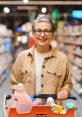 Mature woman shopping for household cleaning supplies
