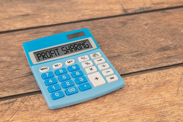 Wooden blocks with words 'PROFIT SHARING'. Business concept.