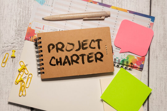 Project Charter text on blackboard, business concept background
