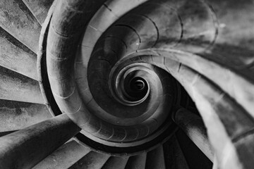 Abstract black and white spiral staircase viewed from above