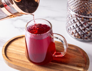 Red tea poured in clear glass
