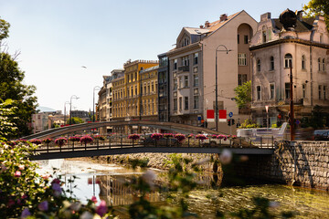 Fototapeta premium Embankment of Miljacka River in Sarajevo in the summer. Bosnia and Herzegovina