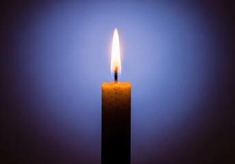A brightly burning, single birthday candle stands alone, symbolizing hope, celebration, and the passage of time on an anniversary, smooth, happy, festive