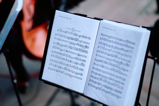 Close-up open sheet music on music stand