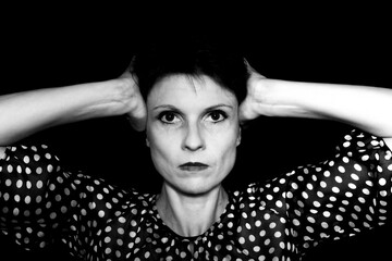 Stressed businesswoman under pressure in professional environment