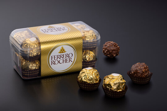 Ferrero Rocher Chocolate Box with Hazelnut Pralines on Dark Background, Editorial Illustrative Product Image
