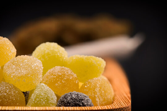 Cannabis Edibles thc, cbn, cbd jelly Gummies, medical drug products. Marijuana infused gummy candies food products photo on a black background