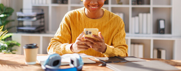 Education, phone and smile with student woman in afro hair at school for growth, Notes and Studying Online.
