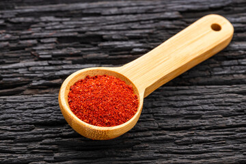 Bixa Orellana - Crushed annatto seeds in the spoon