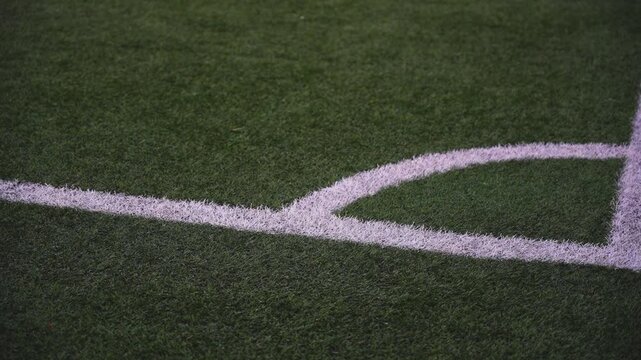 Super slow-motion video of the corner of a soccer field. 100fps
