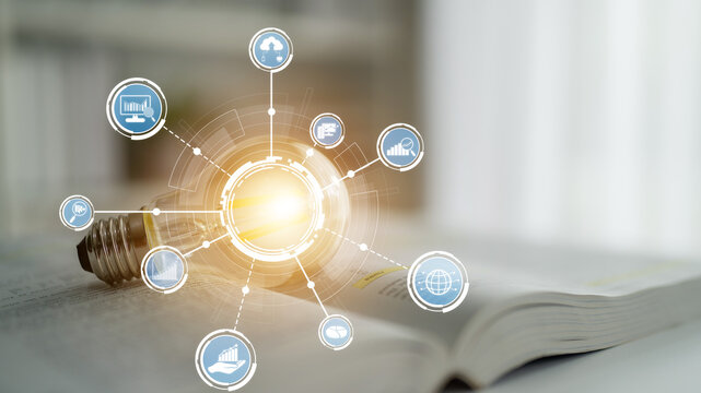 A light bulb sits atop an open book, surrounded by data icons that symbolize business innovation and digital transformation. Perfect for technology and education themes. Crux - Powered by Adobe