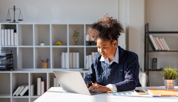 Business in afro hair bookkeeper working with financial report in in office. accountant or financial manager working with taxes, loans, debit and credit operations. Audit, statistics, tax, accounting
