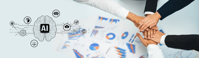 Obraz premium A diverse team collaborates over business analytics, integrating AI technology to enhance strategies, productivity, and innovative solutions in a modern workspace. Trope