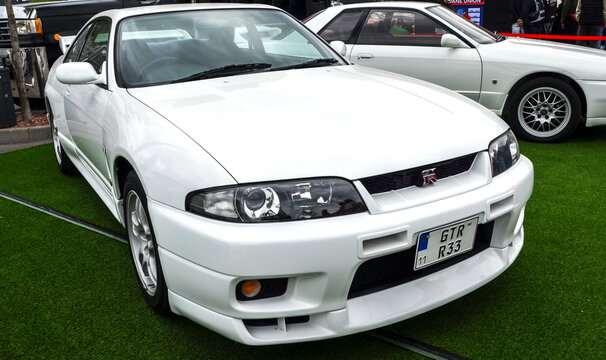 Pristine white Nissan Skyline GT-R R33 generation sports coupe successor is celebrated for its powerful all wheel drive system and blend of luxury and high performance