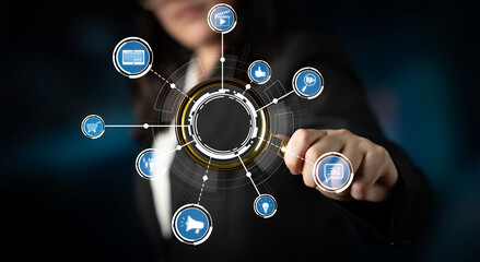 A business professional interacts with an innovative digital interface, showcasing various social media and technology concepts against a sleek dark background. Crux