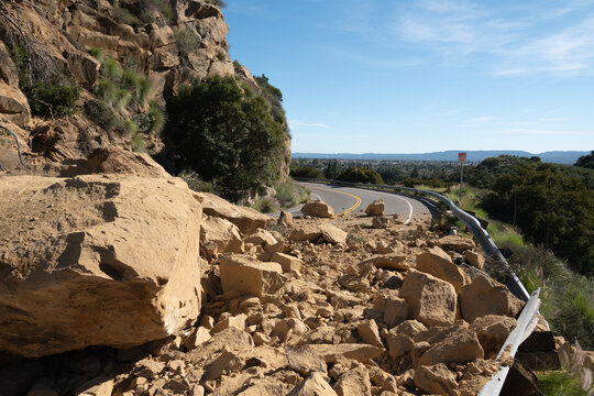 Rock slide boulders blocking Santa Susana Pass Road in the Chatsworth neighborhood of Los Angeles California.  