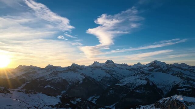 Dynamic Alpine Atmosphere High-altitude cirrus clouds gracefully drifting and evolving over rugged terrain. mountain cirrus brush