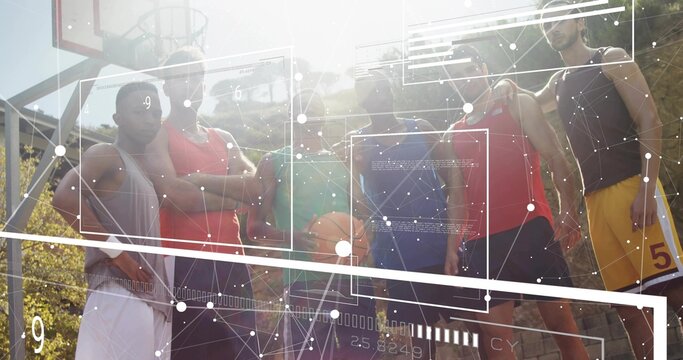 Posing six players wearing jerseys on outdoor court holding orange basketball, hoop and AR overlays - Powered by Adobe