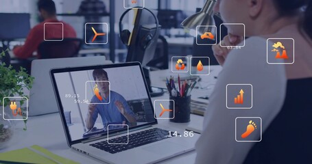 Viewing woman in business-casual top resting chin at open office using laptop AR icons, copy space