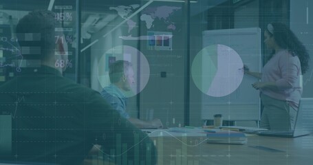 Presenting woman holding marker pointing at flip chart in conference room, wearing light top