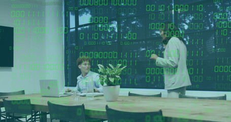 Typing woman at laptop and gesturing man in blazer in conference room, green binary overlay