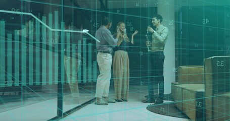 Clinking champagne flutes, business casual trio chatting in office atrium with glass data display