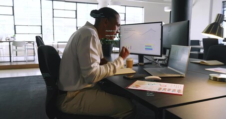 Reviewing monitor charts, man in light shirt khakis with laptop report in open office, copy space