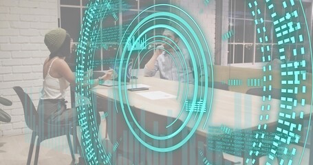 Projecting cyan AR circular interface hovering over office meeting table, beanie woman gesturing