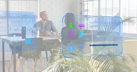 Talking man in light shirt and woman in dark blazer at office table, with AR overlays