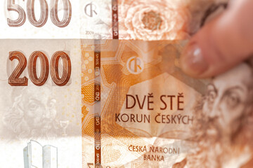 Five hundred and two hundred Czech crown banknotes in hands, close-up. Monetary currency of the Czech Republic. currency of the country is the Czech Republic.