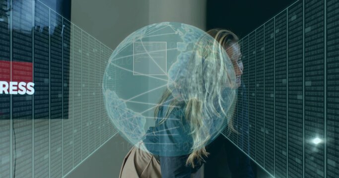 Walking woman in blazer carrying shoulder bag through data aisle, passing server racks, hologram - Powered by Adobe