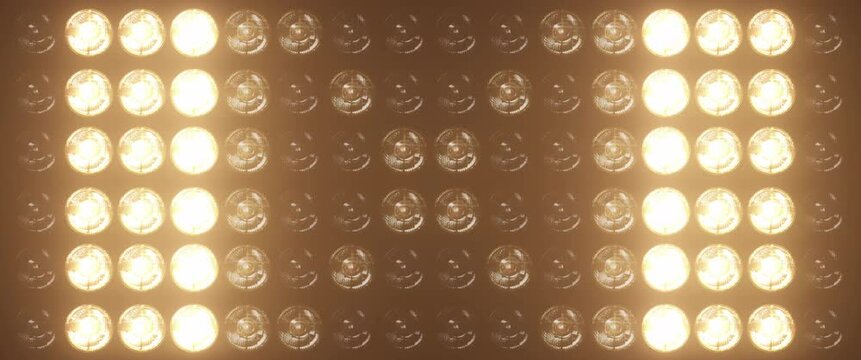 Widescreen flashing lights with bright warm lamps pulsing in patterns, perfect for music videos, club events, and show intros, concert visuals and dynamic stage backgrounds