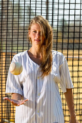 Springtime Confidence: A Radiant Athlete Shines on the Sunlit Baseball Diamond