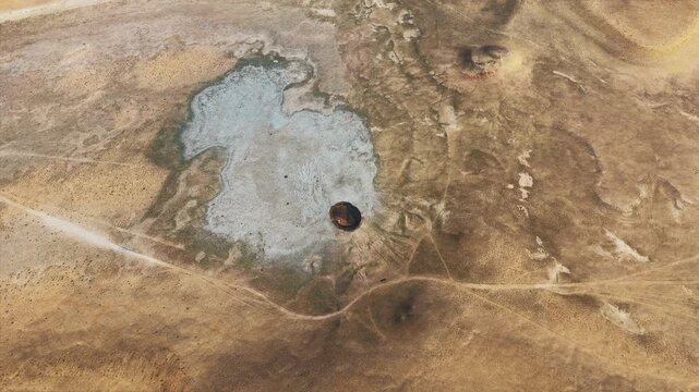 Top aerial shot of Darvaza Gas Crater - Door to Hell in Derweze. Turkmenistan