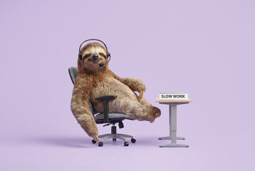 A relaxed sloth wearing a headset sits in an office chair next to a desk