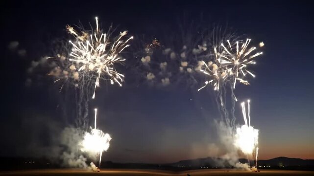 Spectacular fireworks display illuminating the night sky with vibrant bursts of light and color.