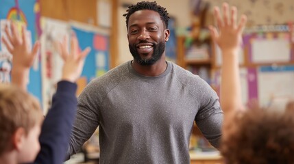 Enthusiastic male teacher engaging with students in a vibrant classroom setting.