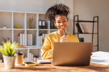 African american in afro hair business of accountant's hands using calculator and taking notes...