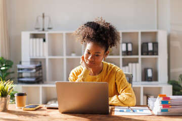 African american in afro hair business people analysis summary graph reports of business operating expenses and work data about the company's financial statements.
