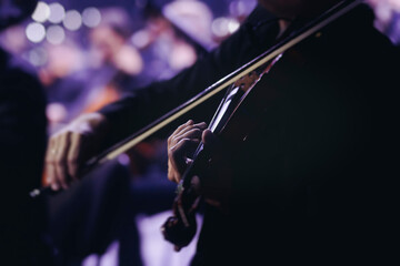 Concert view of violinist with vocalist and musical band, fiddler performing classical music, symphony orchestra performing music, violin player on stage in a club, music arena hall, fiddle and bow