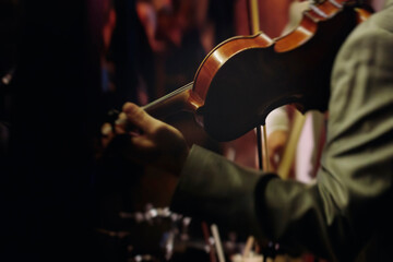 Concert view of violinist with vocalist and musical band, fiddler performing classical music,...