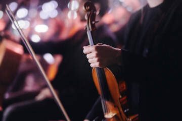 Concert view of violinist with vocalist and musical band, fiddler performing classical music,...